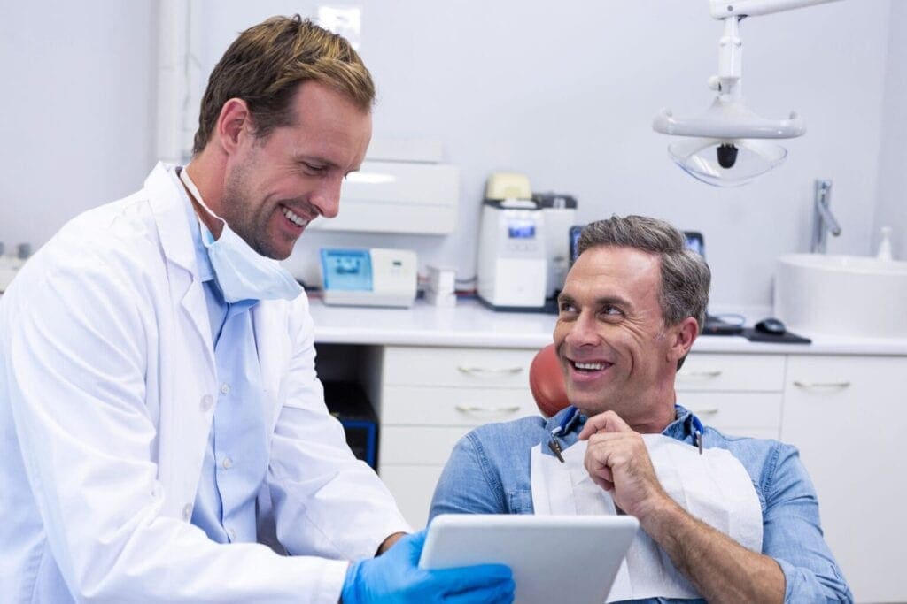 Dentist With Patient Showing Options
